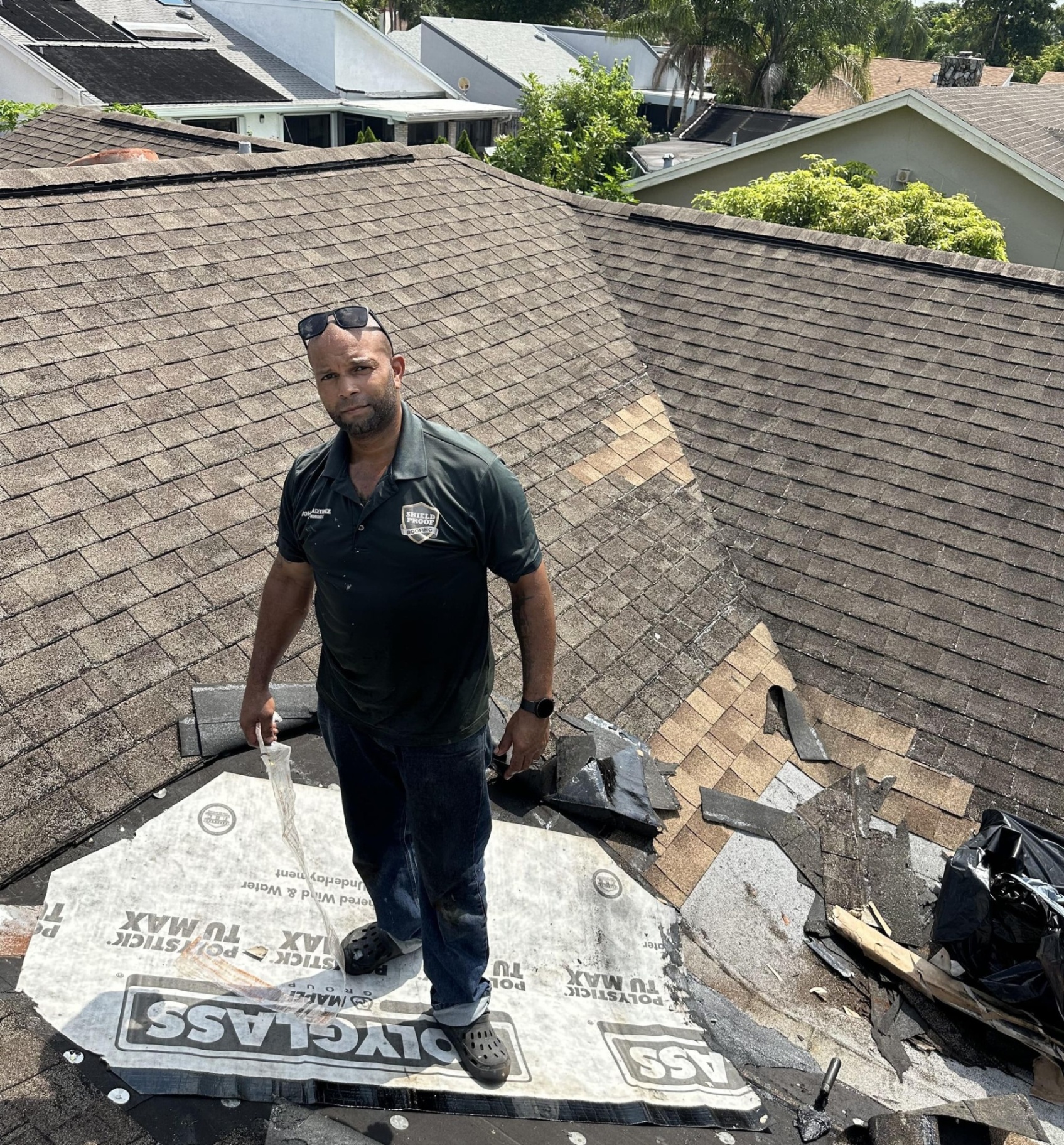 Aerial view of residential and commercial roofing projects by Shield Proof Roofing